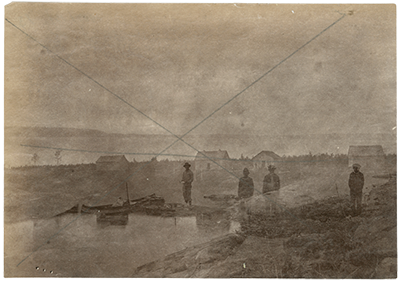 Archives of Manitoba, Hudsons Bay Company Archives, James McDougall fonds, 1987/13/13, Unnamed, no date [double exposure, one of post, one of four men and loaded canoe], ca. 1889, H4-197-4-1